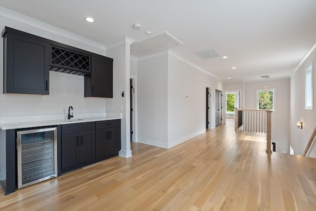 1541 Battlefield Dr Unit A, Nashville, TN 37215 - indoor wet bar featuring wine cooler, crown molding, light wood-style floors, baseboards, and recessed lighting