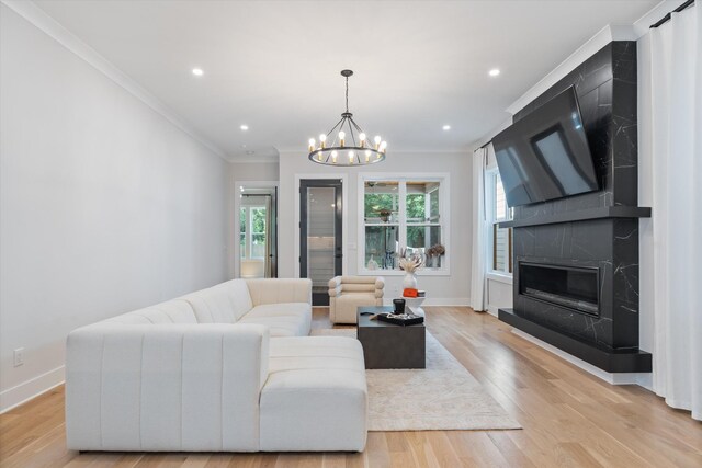 1541 Battlefield Dr Unit A, Nashville, TN 37215 - living room featuring ornamental molding, a chandelier, baseboards, light wood-style flooring, and a premium fireplace
