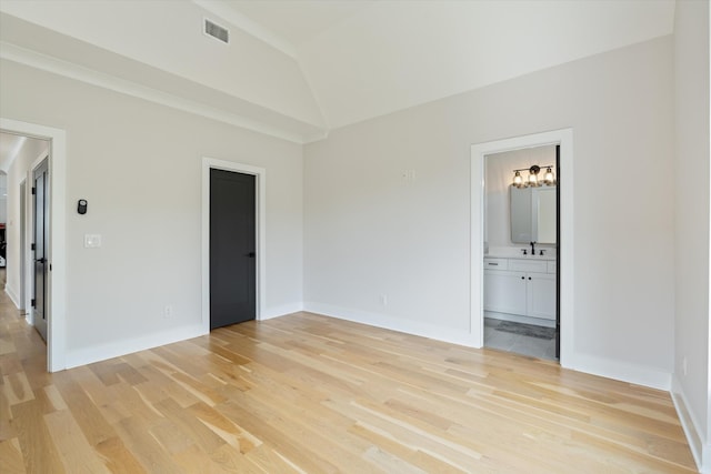 1541 Battlefield Dr Unit A, Nashville, TN 37215 - empty room featuring light wood finished floors, lofted ceiling, a sink, and baseboards