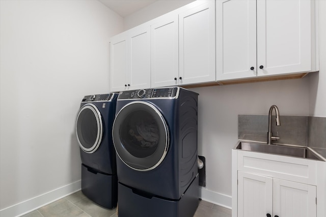 1541 Battlefield Dr Unit A, Nashville, TN 37215 - laundry area with cabinet space, washing machine and clothes dryer, baseboards, and light tile patterned floors