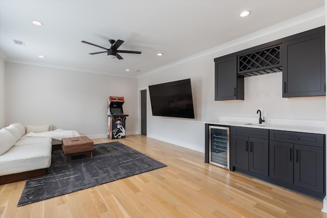 1541 Battlefield Dr Unit A, Nashville, TN 37215 - living room featuring beverage cooler, bar with sink, a ceiling fan, light wood-style floors, and recessed lighting