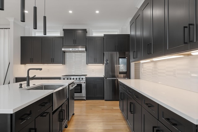 1541 Battlefield Dr Unit A, Nashville, TN 37215 - kitchen with stainless steel appliances, light countertops, light wood finished floors, under cabinet range hood, and recessed lighting