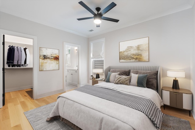 1541 Battlefield Dr Unit A, Nashville, TN 37215 - bedroom featuring a walk in closet, light wood-style flooring, a closet, ensuite bath, and ceiling fan