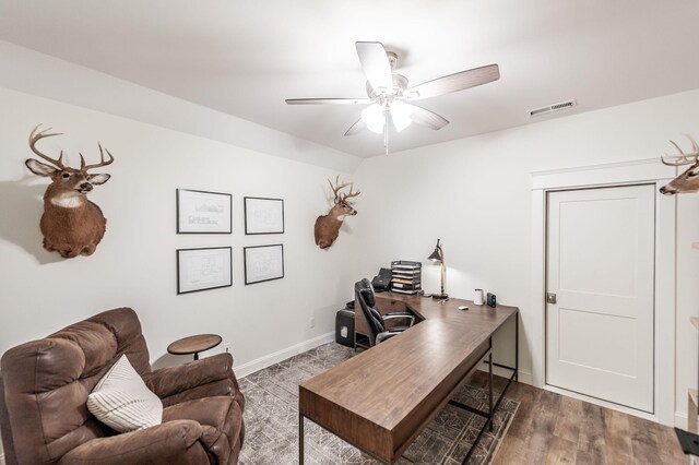 office area featuring ceiling fan and baseboards