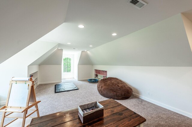 living area featuring carpet, vaulted ceiling, baseboards, and recessed lighting