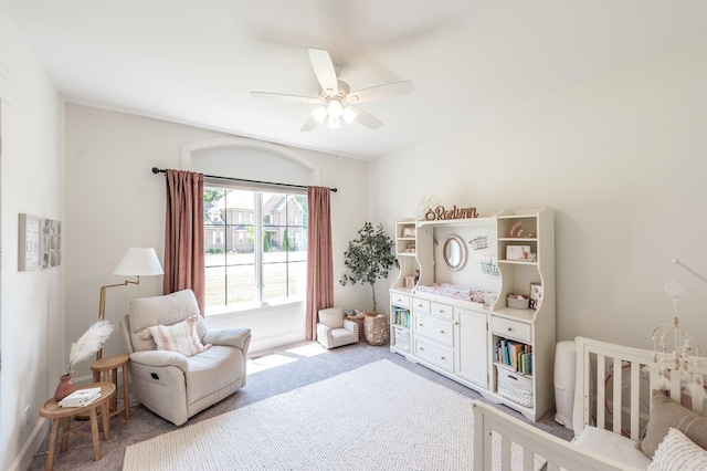 bedroom with light carpet and ceiling fan