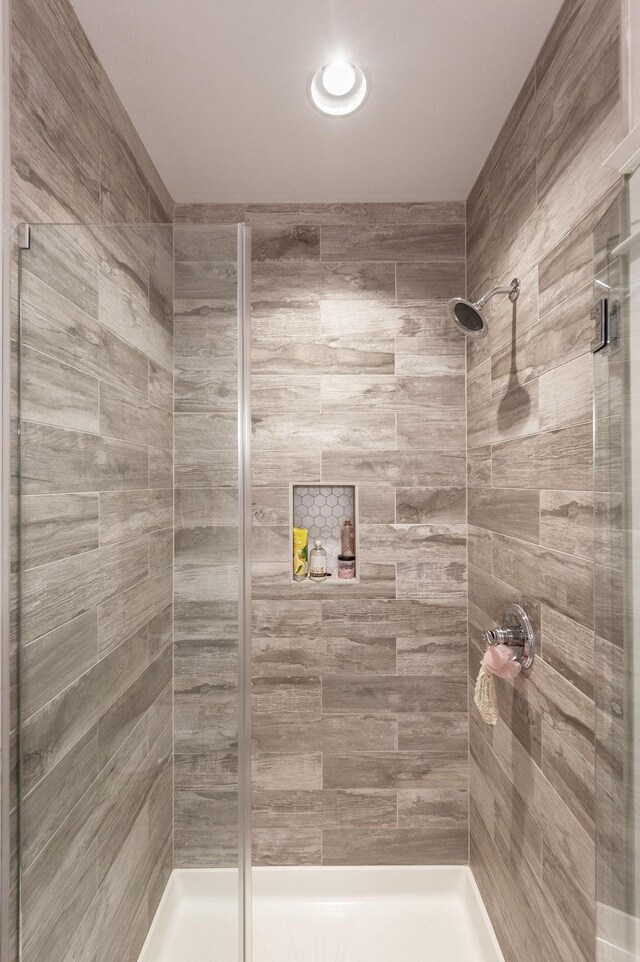 full bathroom with a shower stall