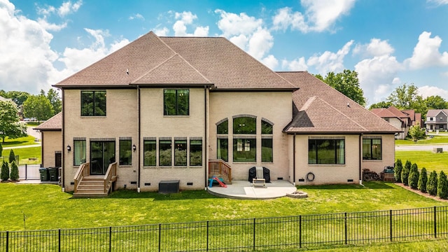 rear view of property with crawl space and a patio area
