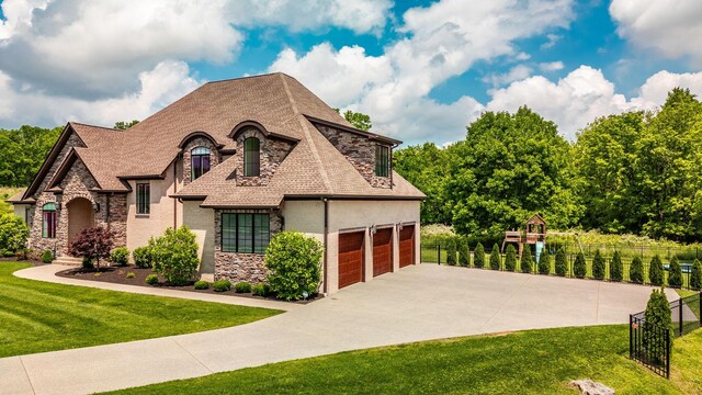 view of front facade with stone siding, driveway, and stucco siding