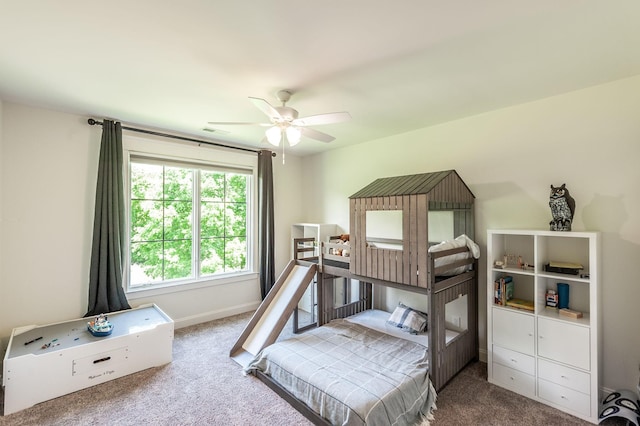bedroom with carpet flooring, baseboards, and a ceiling fan