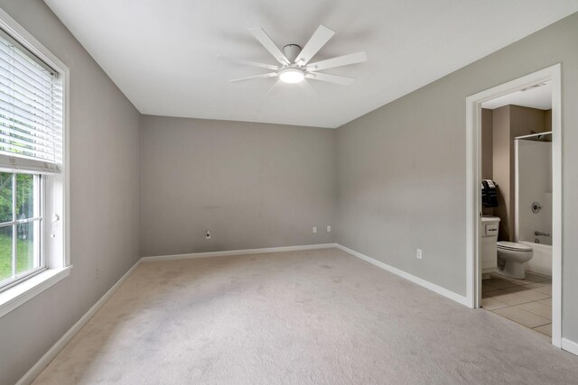123 Eastdale Ln, Dickson, TN 37055 - spare room with light carpet, a ceiling fan, and baseboards