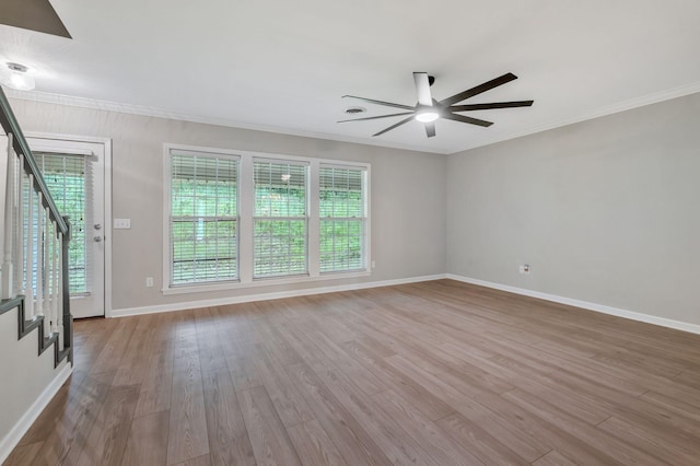 123 Eastdale Ln, Dickson, TN 37055 - spare room featuring ceiling fan, stairs, healthy amount of natural light, wood finished floors, and ornamental molding