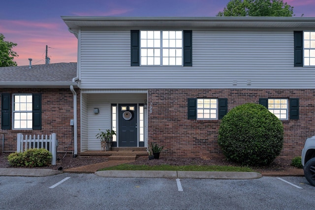 123 Eastdale Ln, Dickson, TN 37055 - view of front facade with brick siding and uncovered parking