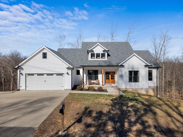 170 Autumn Trl, Dover, TN 37058 - modern inspired farmhouse with covered porch, concrete driveway, board and batten siding, a shingled roof, and an attached garage