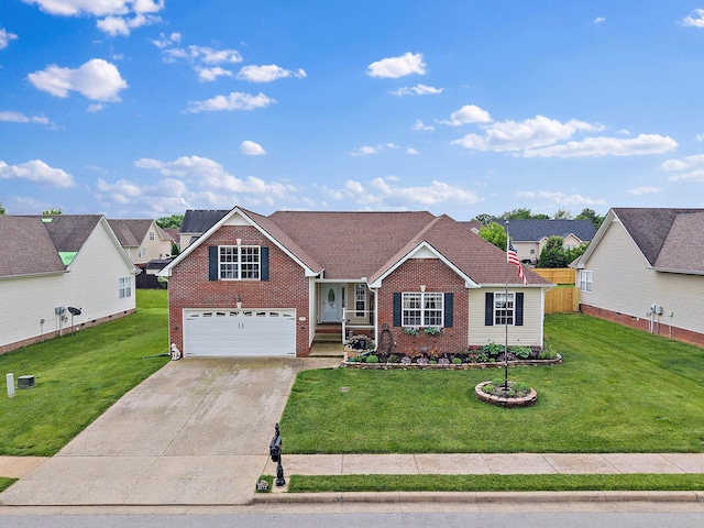 1172 Country Fields Ln, Clarksville, TN 37040 - view of front of property with brick siding, an attached garage, concrete driveway, and a front lawn