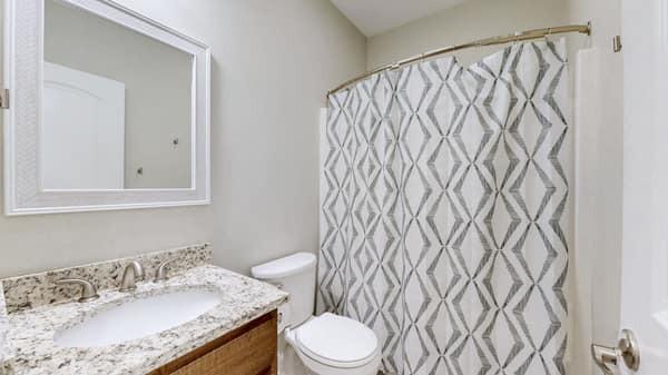 683 Northup Rd, Portland, TN 37148 - bathroom with toilet, vanity, and a shower with curtain