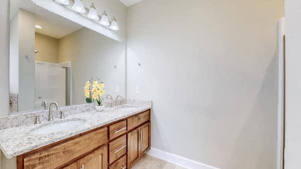 683 Northup Rd, Portland, TN 37148 - full bath with a shower stall, double vanity, baseboards, and tile patterned flooring