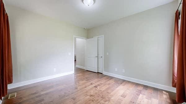 683 Northup Rd, Portland, TN 37148 - unfurnished bedroom with baseboards and wood finished floors
