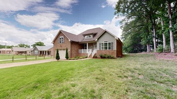 683 Northup Rd, Portland, TN 37148 - view of front of property featuring an attached garage, driveway, and a front lawn