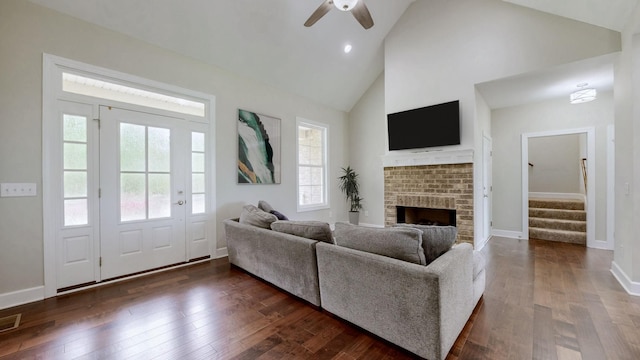 683 Northup Rd, Portland, TN 37148 - living room featuring high vaulted ceiling, stairway, a ceiling fan, a fireplace, and dark wood-style flooring
