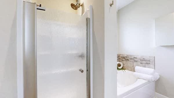 683 Northup Rd, Portland, TN 37148 - bathroom featuring a shower stall and a bath
