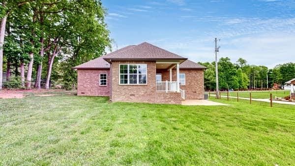 683 Northup Rd, Portland, TN 37148 - back of house featuring brick siding and a patio