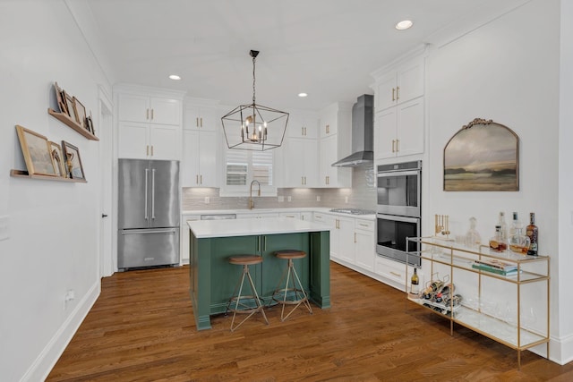 1501 Woodmont Blvd Unit B, Nashville, TN 37215 - kitchen featuring stainless steel appliances, wall chimney exhaust hood, a center island, white cabinetry, and recessed lighting