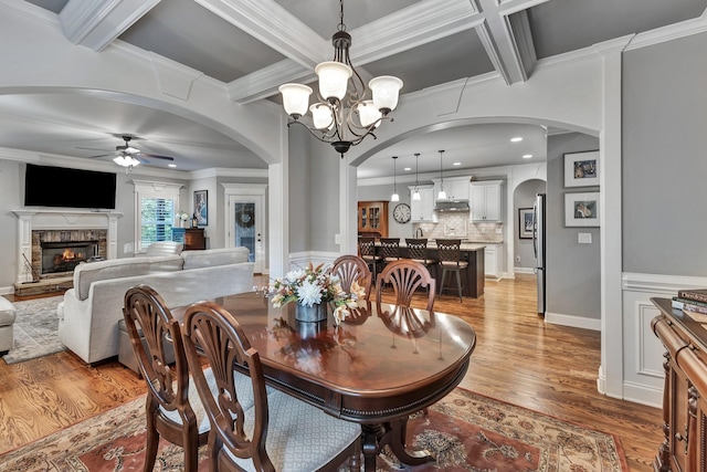 6018 Trotwood Ln, Spring Hill, TN 37174 - dining area with ceiling fan, arched walkways, coffered ceiling, light wood finished floors, and ornamental molding