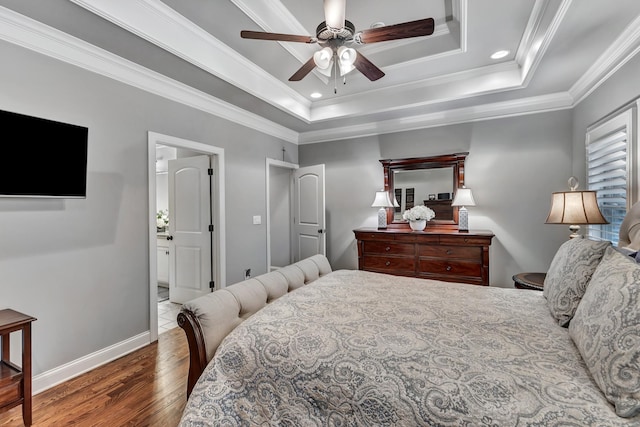 6018 Trotwood Ln, Spring Hill, TN 37174 - bedroom with wood finished floors, a tray ceiling, baseboards, recessed lighting, and crown molding