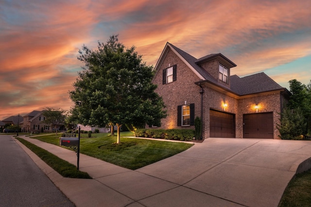 6018 Trotwood Ln, Spring Hill, TN 37174 - view of front of home with brick siding, concrete driveway, a front yard, and a garage