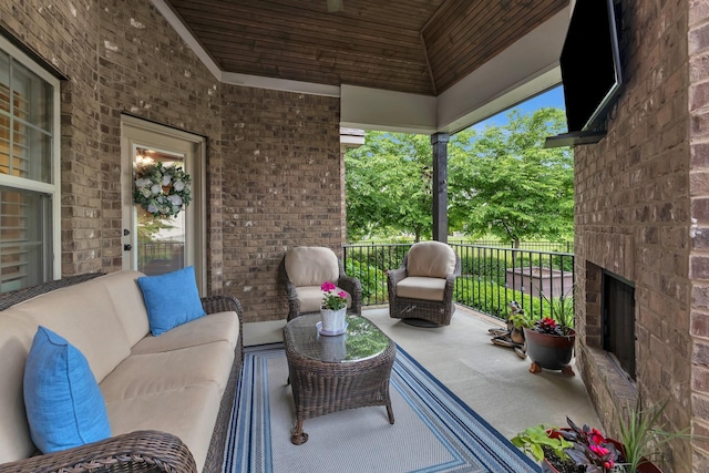 6018 Trotwood Ln, Spring Hill, TN 37174 - view of patio / terrace with an outdoor living space with a fireplace