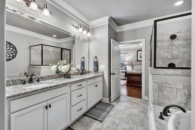 6018 Trotwood Ln, Spring Hill, TN 37174 - ensuite bathroom featuring tiled shower, crown molding, double vanity, recessed lighting, and a bathtub