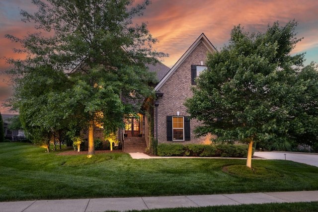6018 Trotwood Ln, Spring Hill, TN 37174 - view of property hidden behind natural elements with brick siding and a front yard