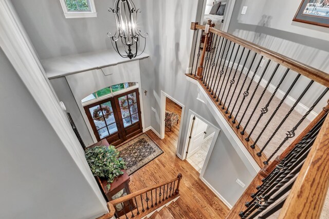 6018 Trotwood Ln, Spring Hill, TN 37174 - foyer featuring wood finished floors, a chandelier, stairway, french doors, and a towering ceiling