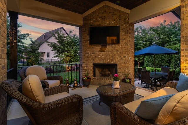 6018 Trotwood Ln, Spring Hill, TN 37174 - view of patio with fence, outdoor dining area, and an outdoor living space with a fireplace