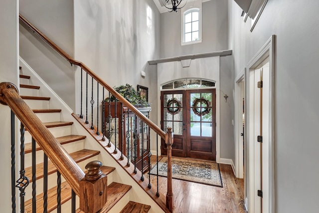 6018 Trotwood Ln, Spring Hill, TN 37174 - foyer entrance with wood finished floors, a towering ceiling, a chandelier, stairway, and baseboards