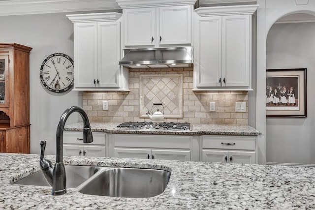 6018 Trotwood Ln, Spring Hill, TN 37174 - kitchen featuring a sink, stainless steel gas cooktop, exhaust hood, and white cabinetry