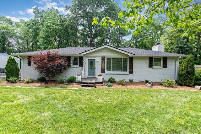 247 High Cliff Dr, Hendersonville, TN 37075 - single story home with brick siding, a chimney, a front yard, and a shingled roof