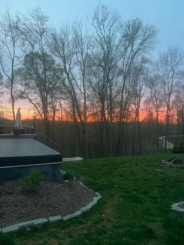 247 High Cliff Dr, Hendersonville, TN 37075 - yard at dusk with a lawn