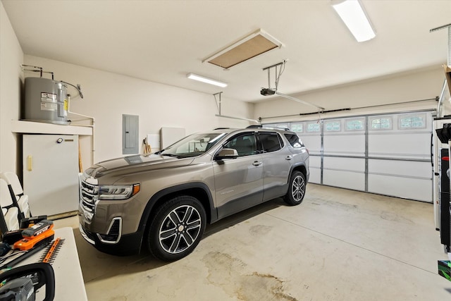 5004 Curtis Way, Cookeville, TN 38506 - garage featuring a garage door opener, electric panel, and electric water heater