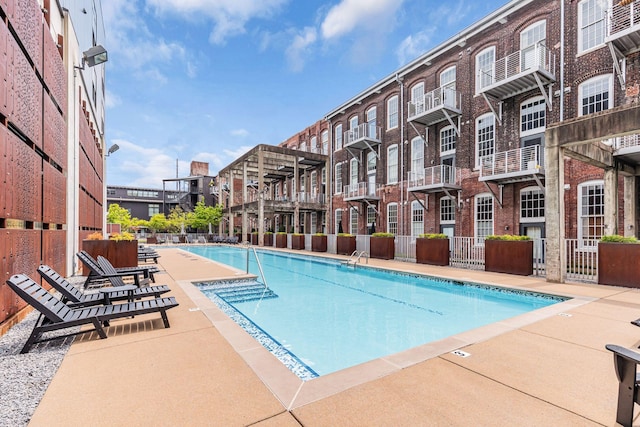 community pool featuring fence