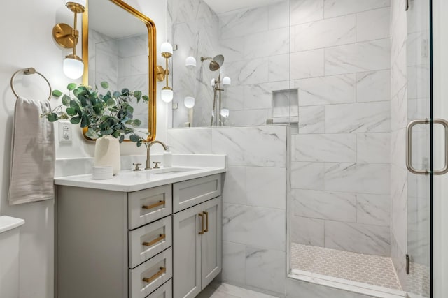 full bath featuring a stall shower and vanity
