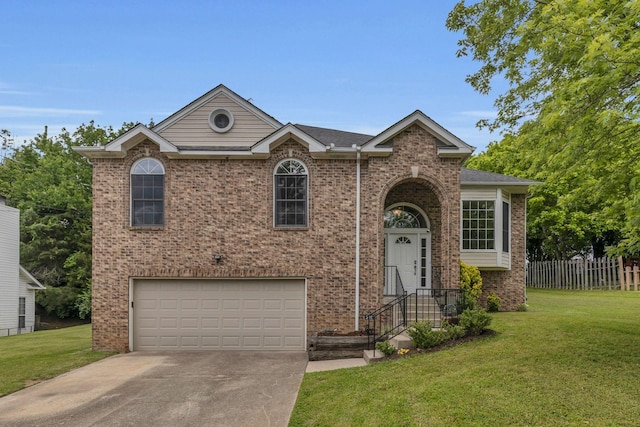 split foyer home featuring an attached garage, concrete driveway, and brick siding