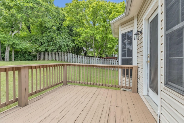 deck featuring view of wooded area