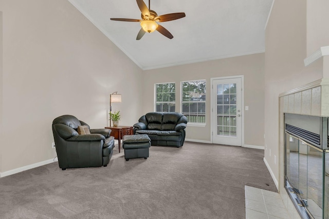living room featuring carpet, ceiling fan, high vaulted ceiling, baseboards, and ornamental molding