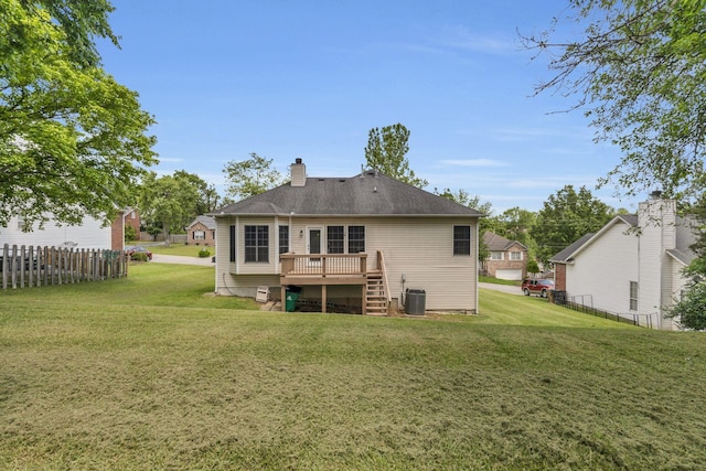 rear view of house with a deck, stairway, central AC, and a chimney