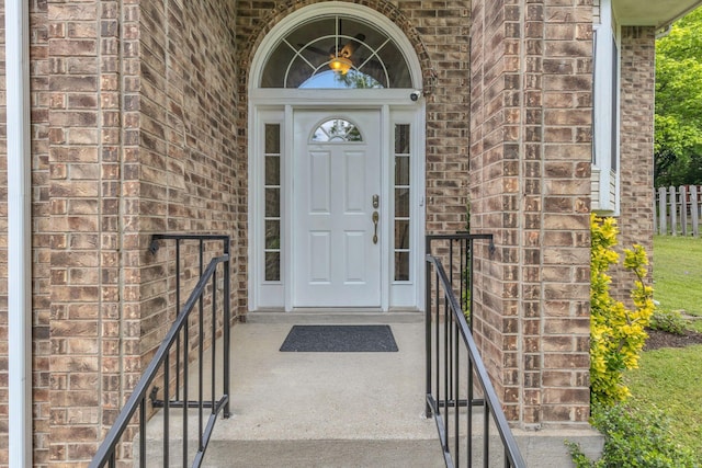 property entrance with brick siding