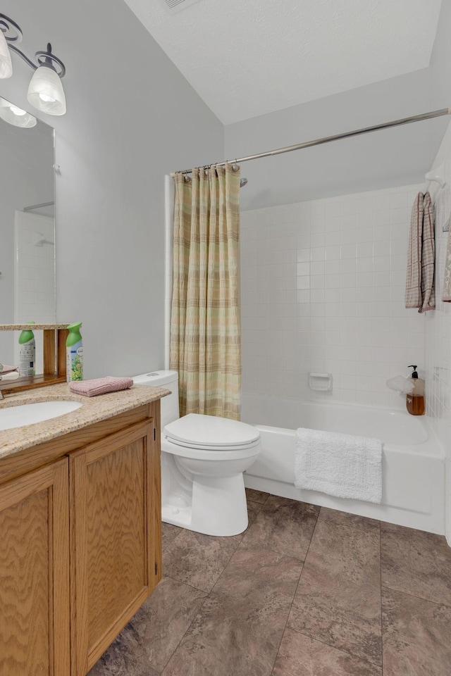 full bath with toilet, vanity, and shower / bath combo