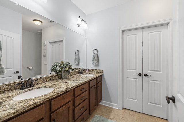 4801 Beryl Dr, Murfreesboro, TN 37128 - full bathroom with double vanity, tile patterned flooring, and baseboards
