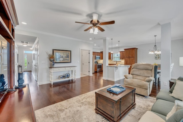 4801 Beryl Dr, Murfreesboro, TN 37128 - living room with a ceiling fan, dark wood finished floors, recessed lighting, a chandelier, and crown molding